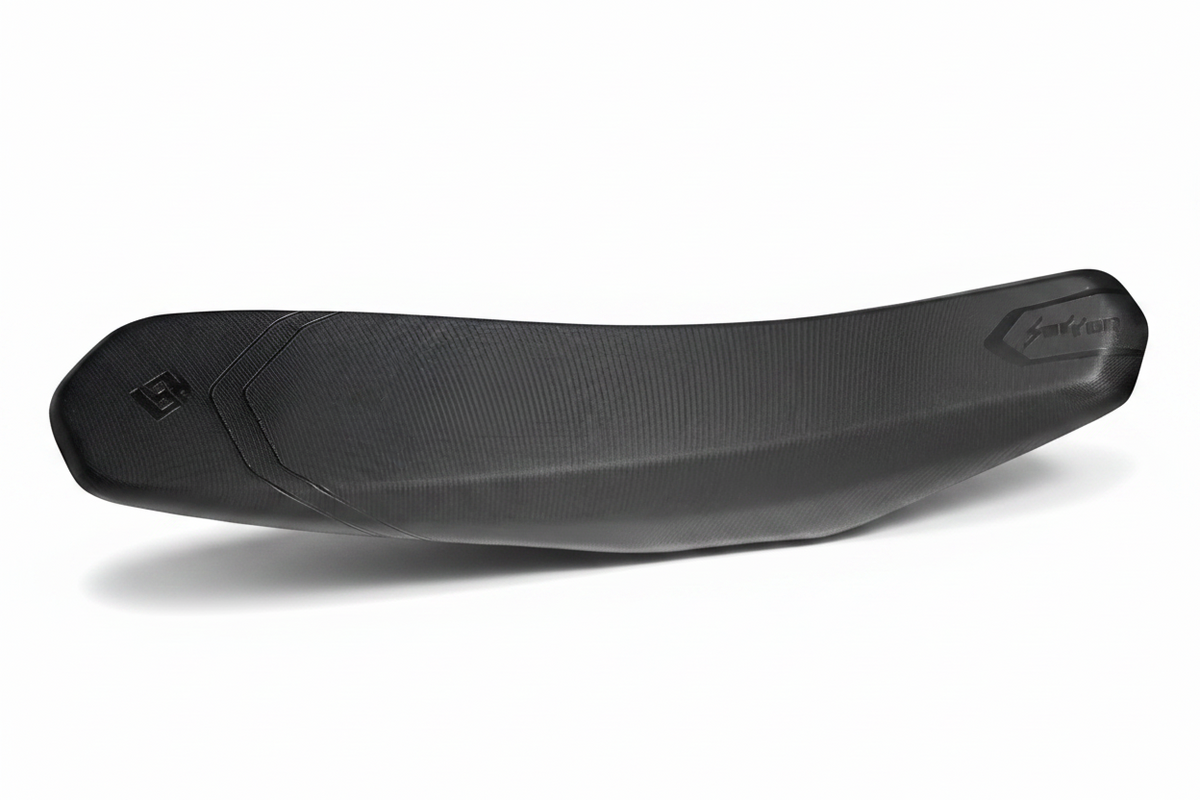 Surron Ultra Bee low-cut seat showing contoured shape and textured cover