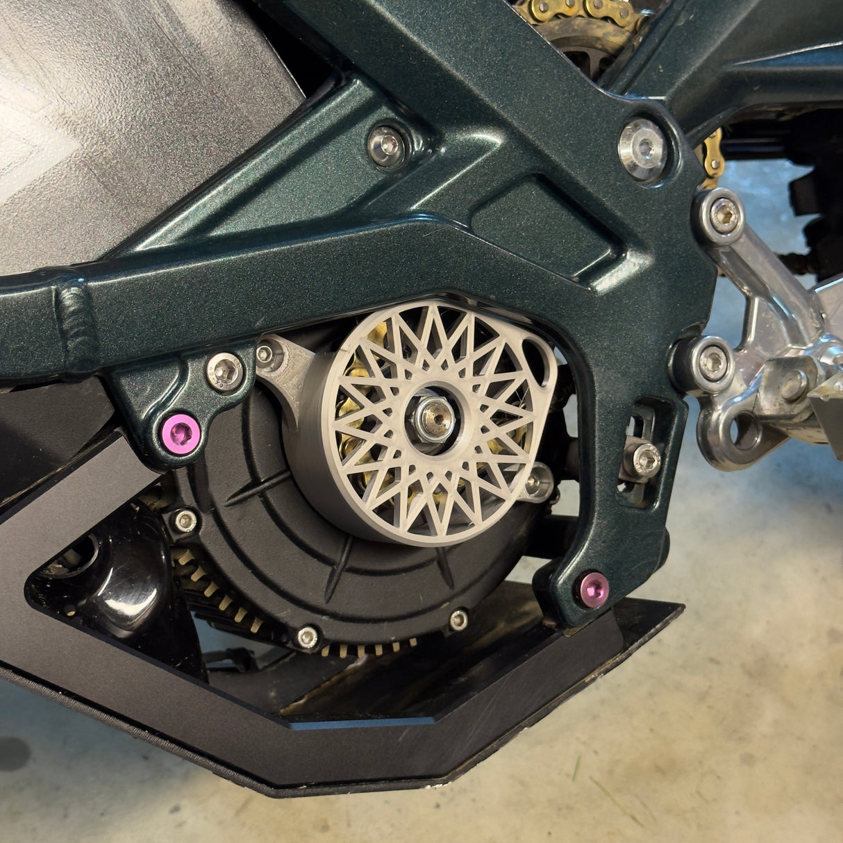 Plastic motor cover installed on Sur-Ron LBX belt drive motor