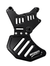 Dual caliper mounting bracket with attached brake disc guard