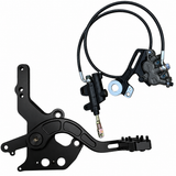 Moto footbrake pedal and mounting plate beside the hydraulic brake assembly for Surron LBX and E-Ride