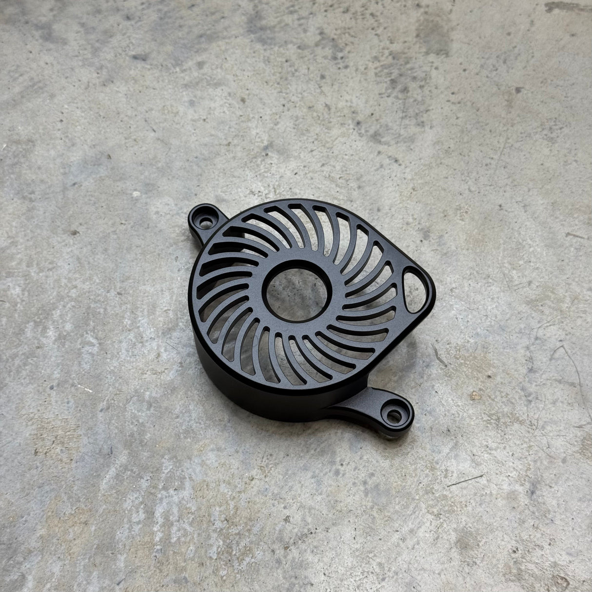 	Spiral anodized black Ultra Bee motor cover, milled billet