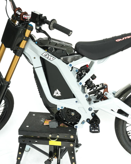 	Matte black battery wrap installed on e-bike, factory-clean blacked-out look, installed on a surron LBX