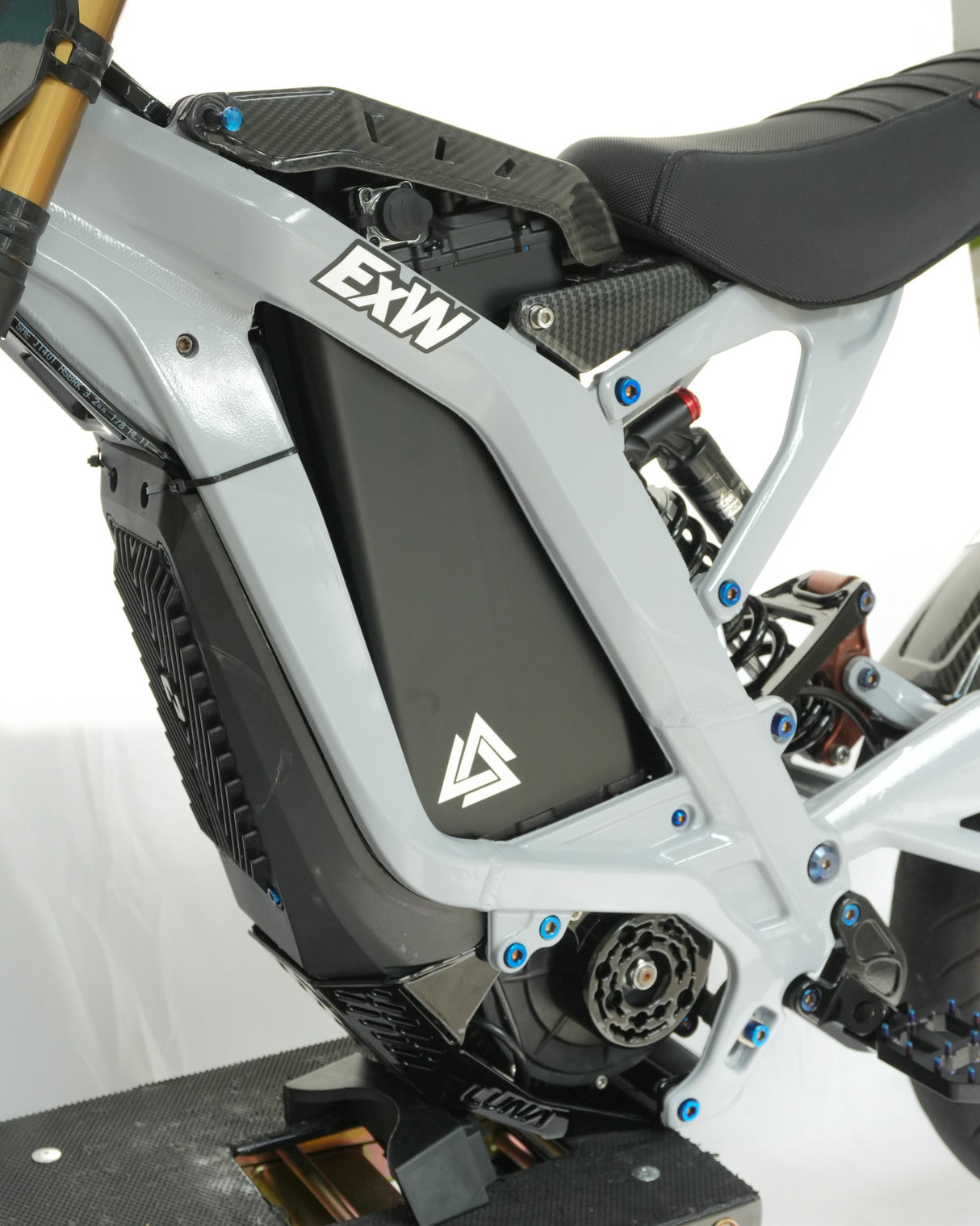 	72V battery wrap with white triangle decal, flush matte finish, installed on bike