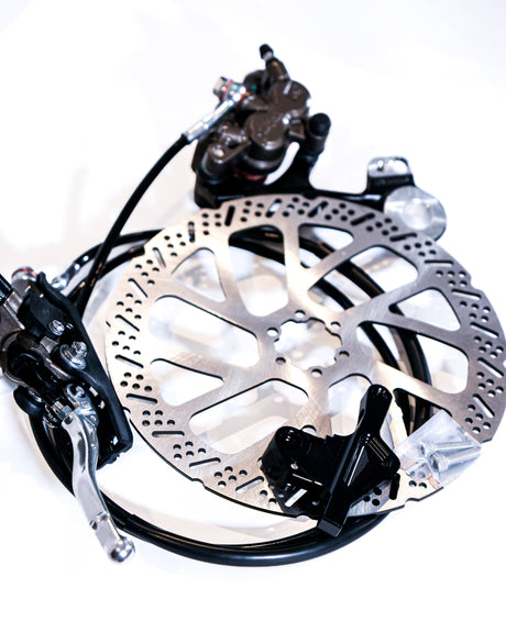 OEM Ultra Bee rear brake caliper close-up, pre-bled hydraulic system