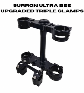 Surron Ultra Bee triple clamp assembly showing steering stem and handlebar mount