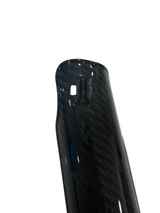 A close up image of a surron lbx fork guard showing off the carbon weave pattern with a white background