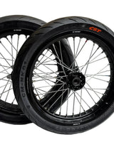 Black Surron Ultra Bee 17-inch supermoto wheelset with mounted CST street tires