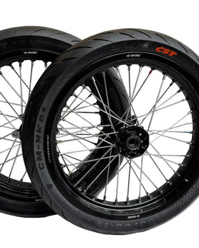 Black Surron Ultra Bee 17-inch supermoto wheelset with mounted CST street tires