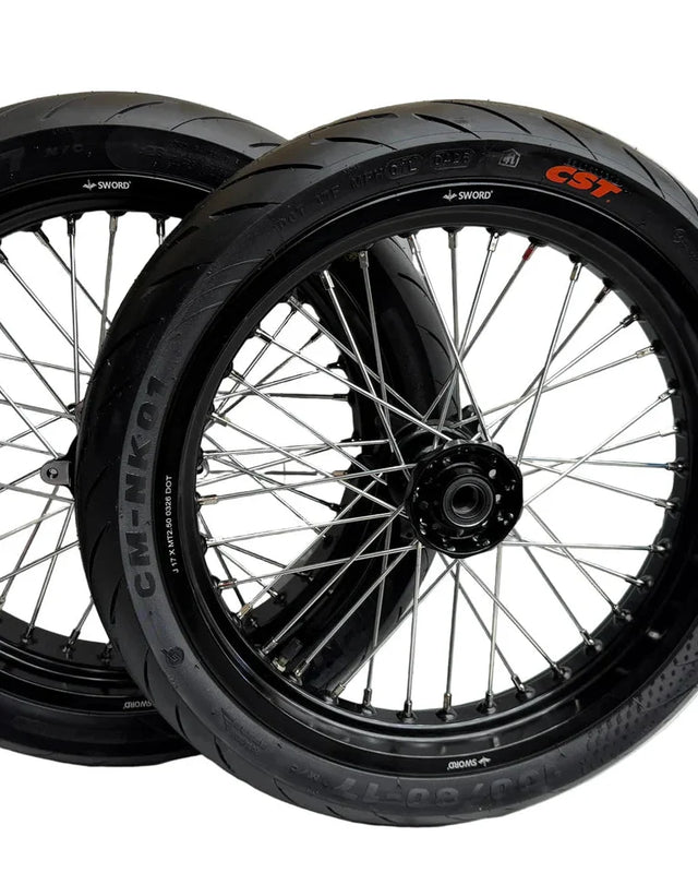 Black Surron Ultra Bee 17-inch supermoto wheelset with mounted CST street tires