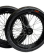 Black Surron Ultra Bee 17-inch supermoto wheelset with mounted CST street tires